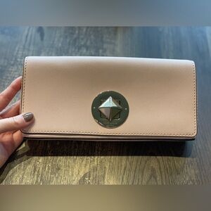 Light pink Kate Spade clutch.